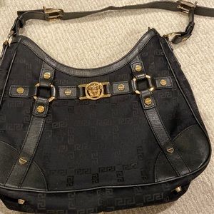 Vintage Versace bag. Black with gold trim.